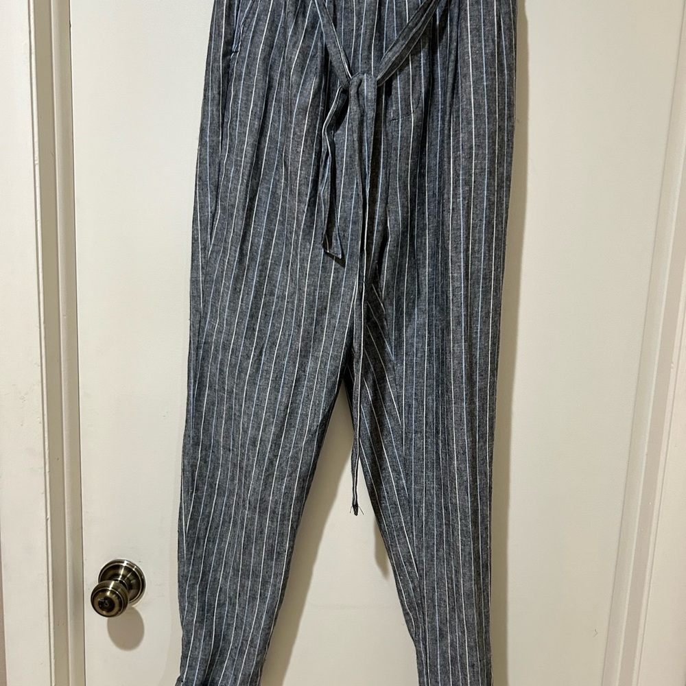 Grey pants with light blue and white pin stripe.